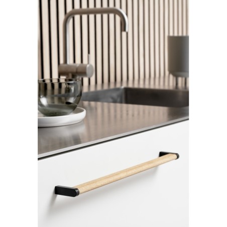 Handle CROSSING used on interior furniture.